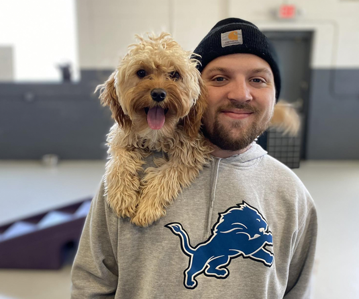 employee with dog on shoulder